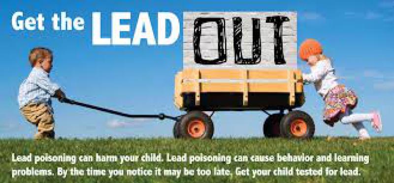 Two young children are seen pushing a wagon across a grassy field. One child is pulling the handle while the other one is pushing the back of the wagon to help. There is text on the image that reads "Get the lead out. Lead poisoning can harm your child. Lead poisoning can cause behavior and learning problems. By the time you notice it may be too late. Get your child tested for lead."